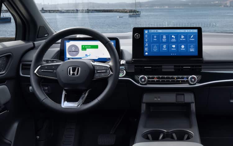 2026 Honda Prologue Elite interior with Gray Leather, featuring the cabin with dashboard and steering wheel.